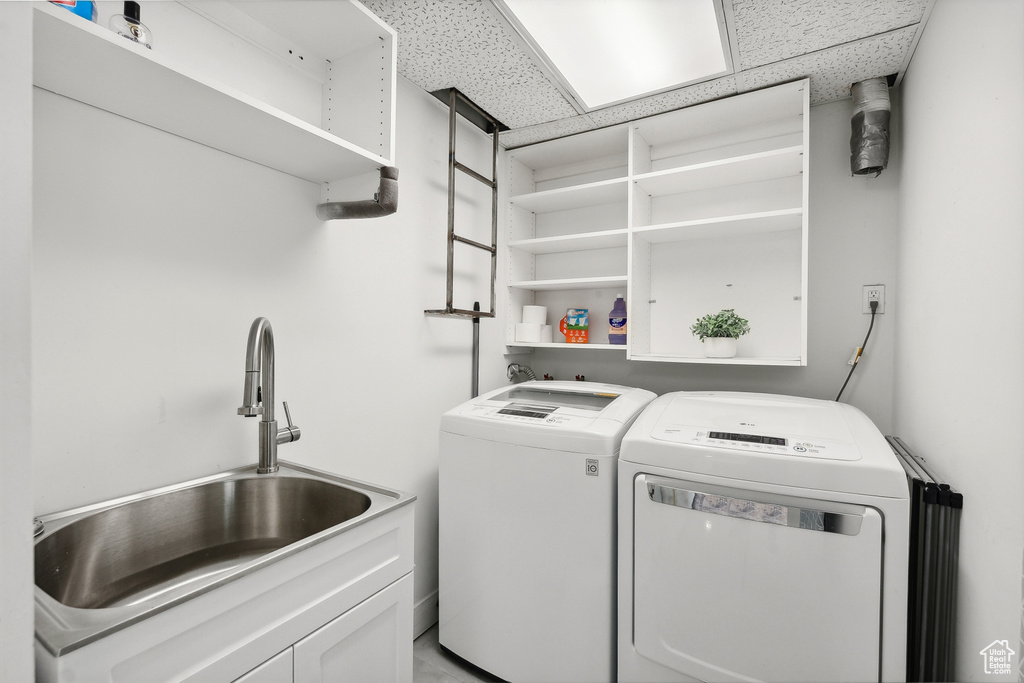 Laundry room featuring washer and clothes dryer