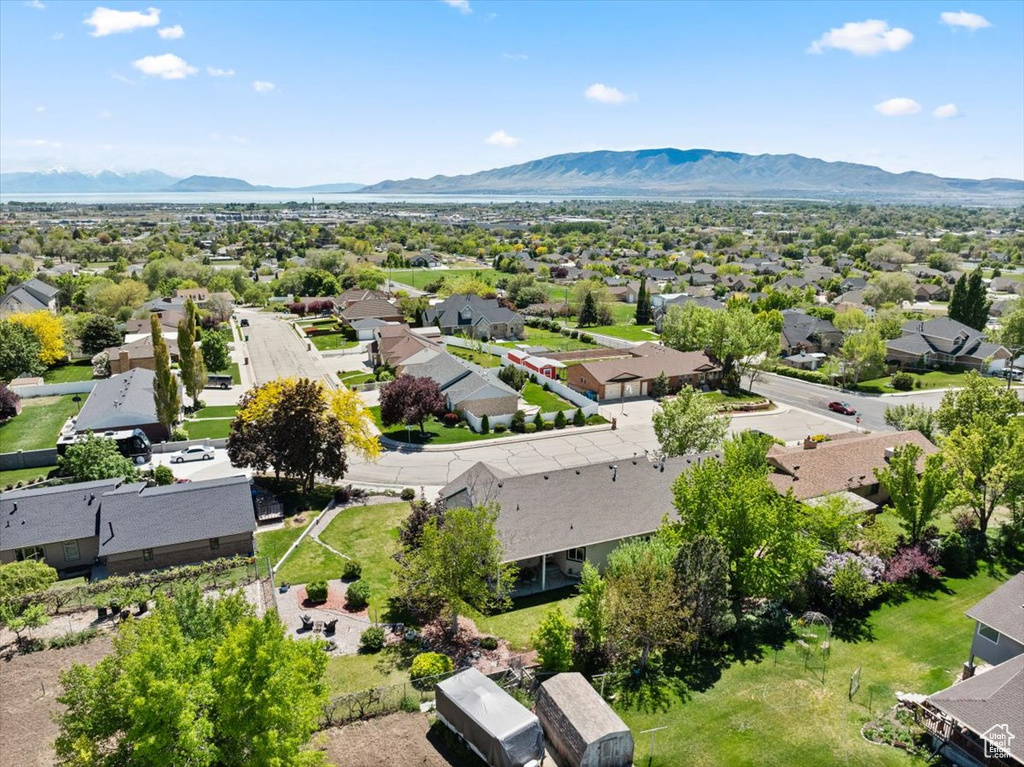 Aerial view of residential area featuring a mountainous background