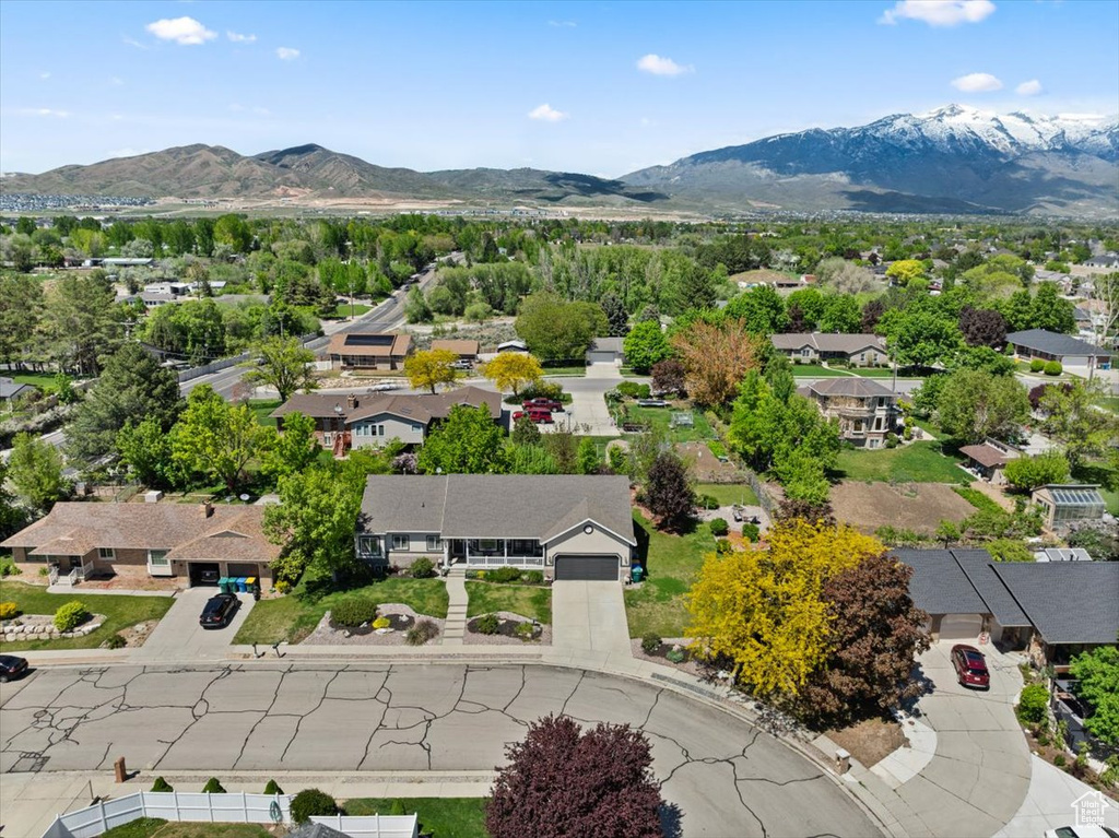 Aerial perspective of suburban area featuring a mountainous background