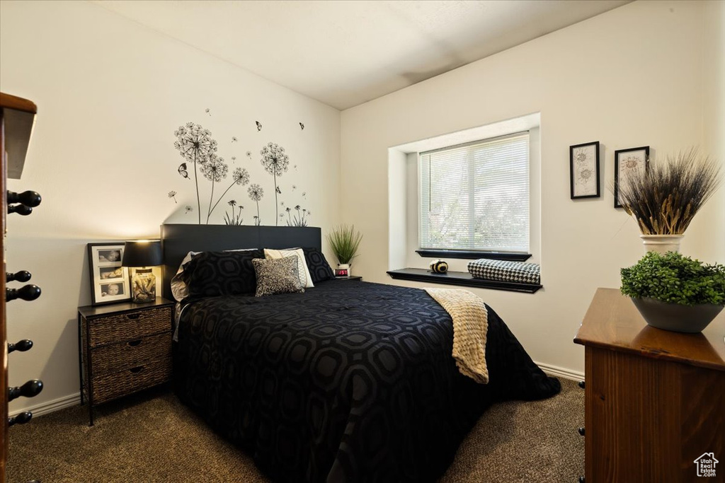 Carpeted bedroom with baseboards