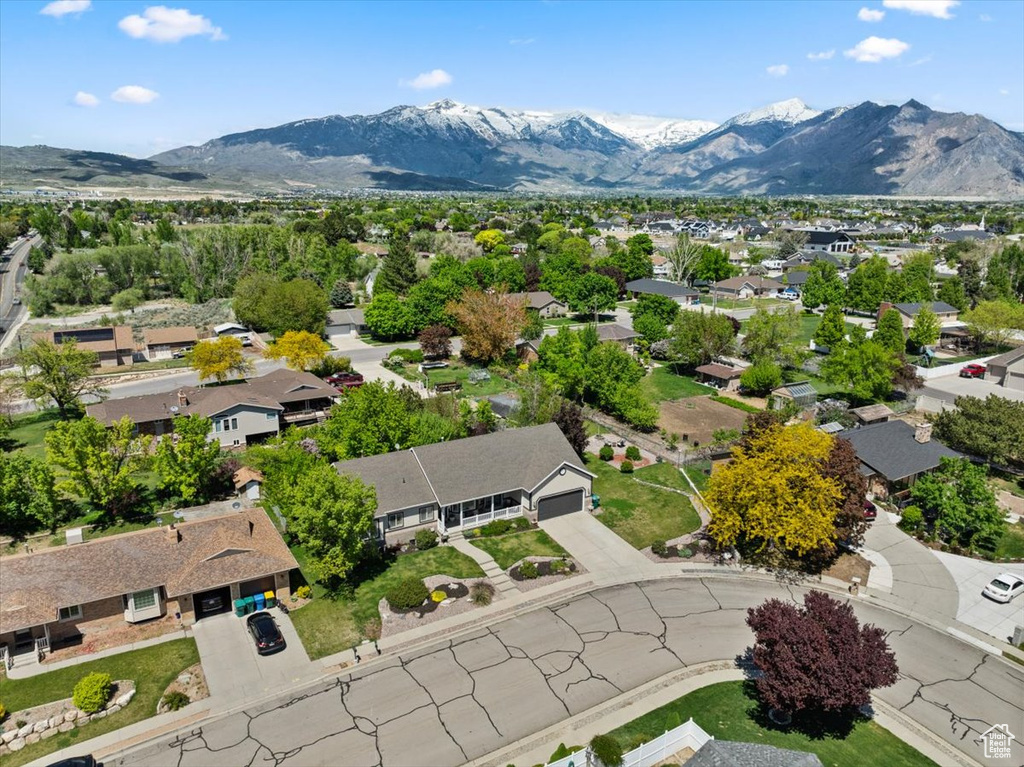 Aerial view of residential area featuring a mountain backdrop