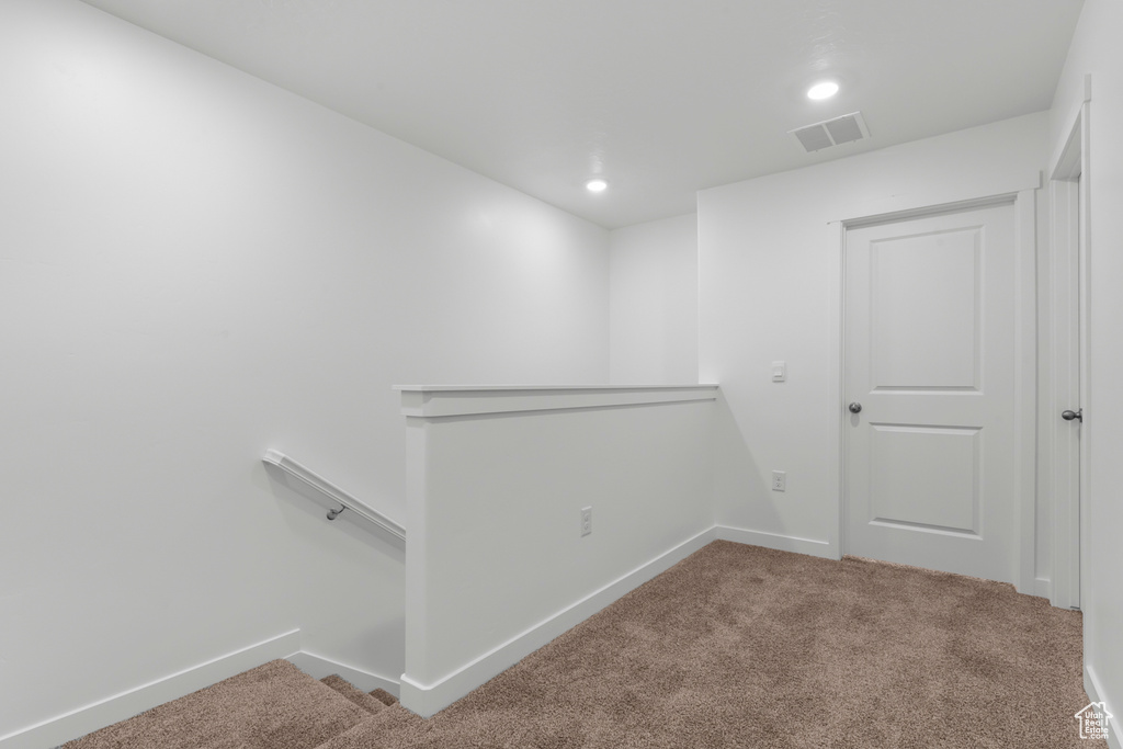 Below grade area featuring carpet flooring, recessed lighting, and baseboards