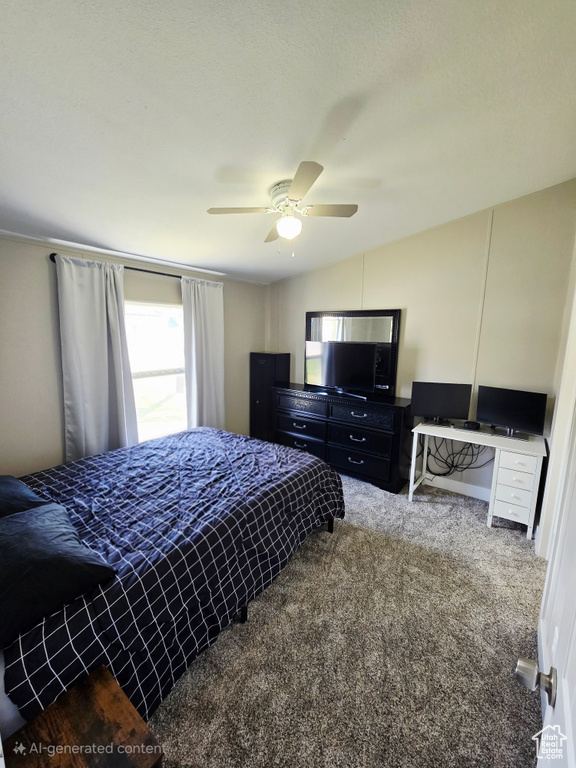 Bedroom featuring carpet floors, a ceiling fan, and vaulted ceiling