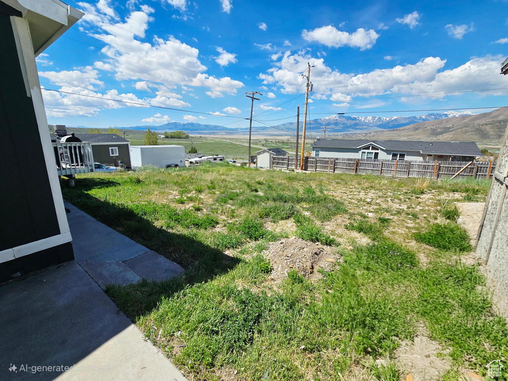 View of yard featuring a mountain view