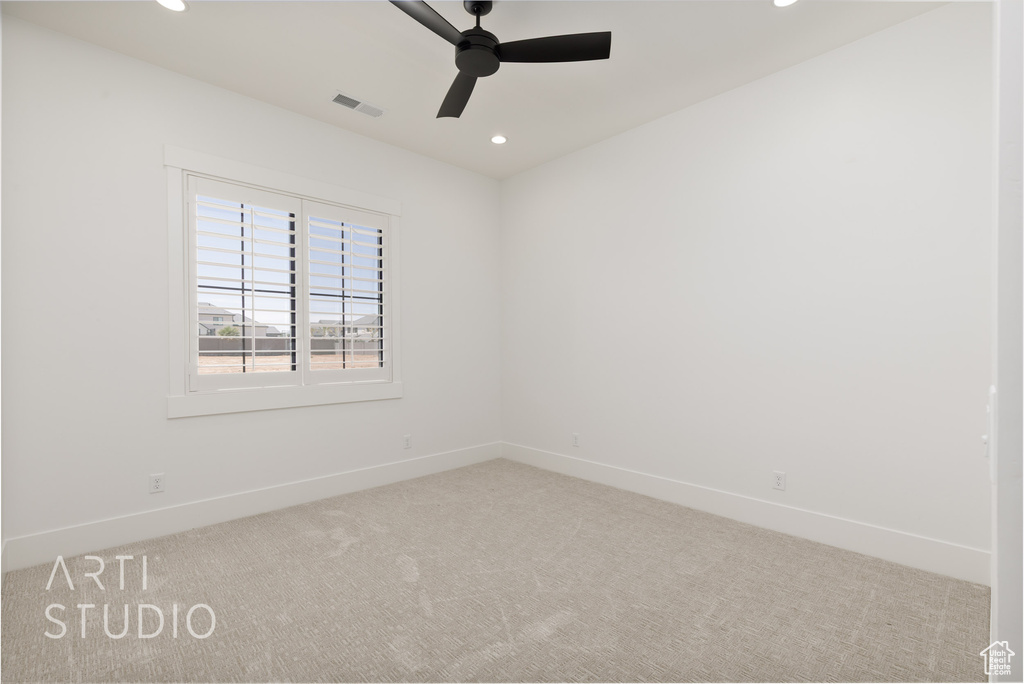 Carpeted empty room with recessed lighting, ceiling fan, and baseboards