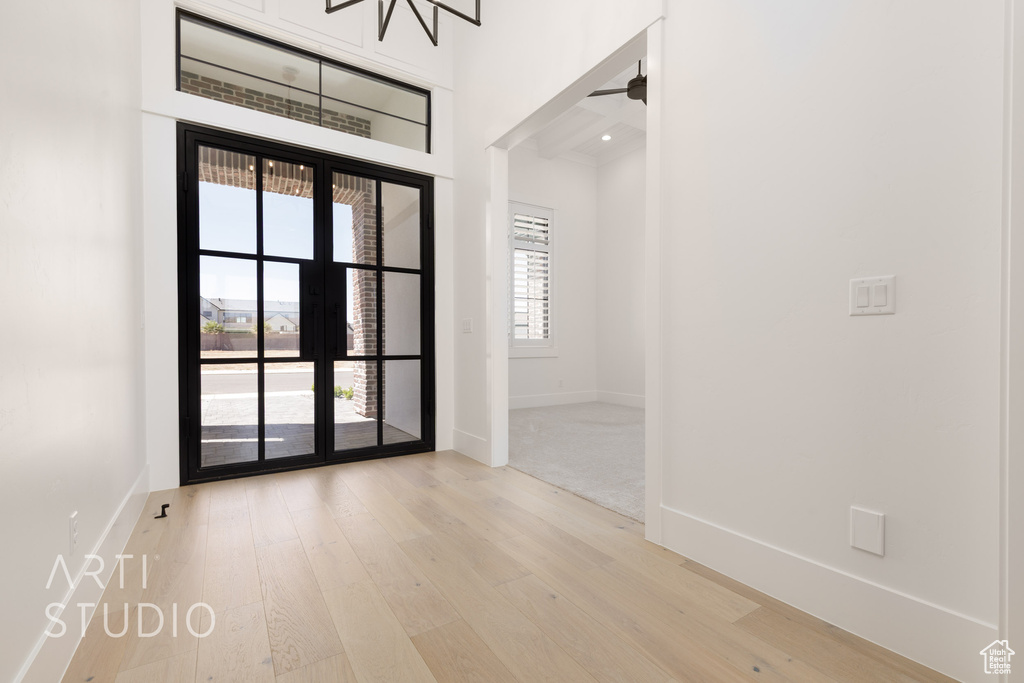 Empty room featuring baseboards and wood finished floors
