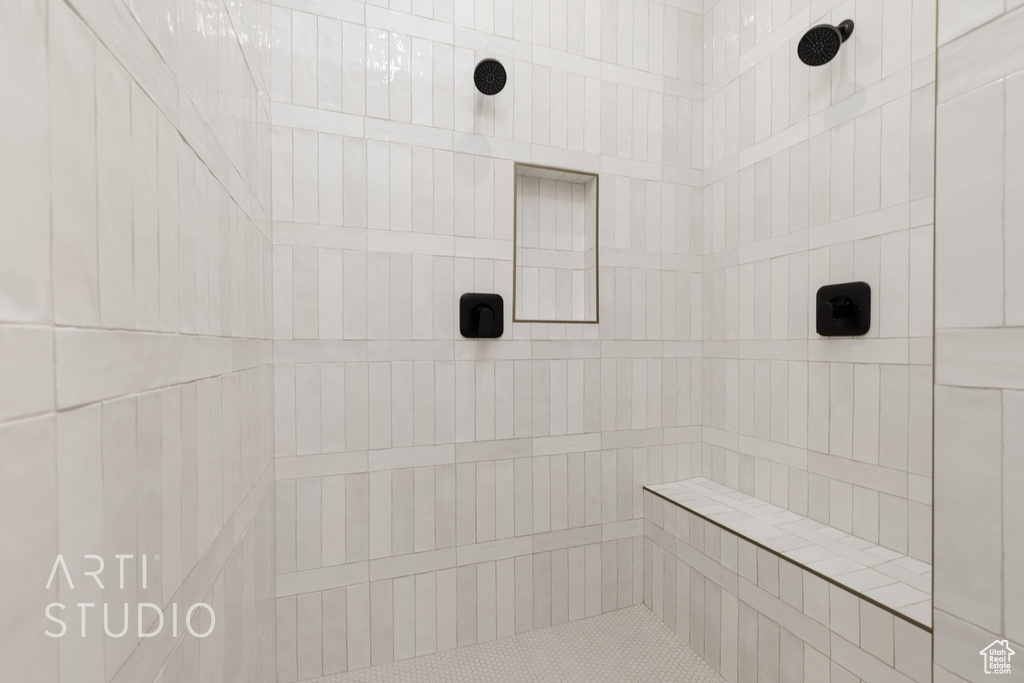 Bathroom featuring a tile shower