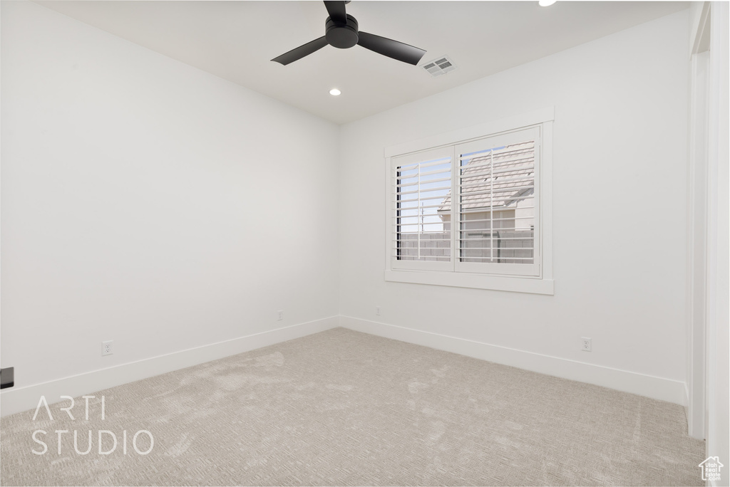 Spare room with carpet flooring, baseboards, recessed lighting, and a ceiling fan