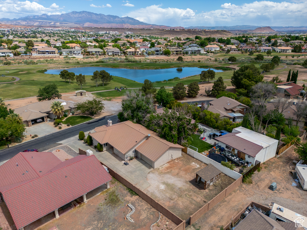 Aerial view of residential area with a water and mountain view and a local golf course
