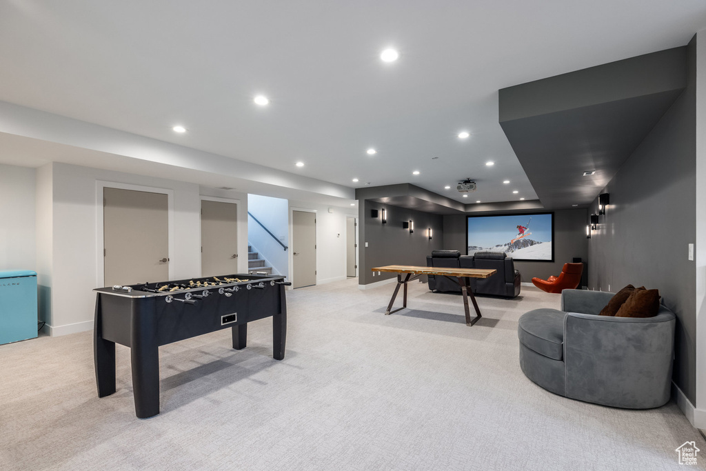 Rec room featuring light colored carpet, baseboards, and recessed lighting