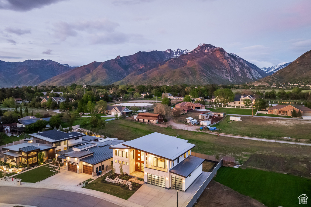 Aerial view of property and surrounding area with mountains