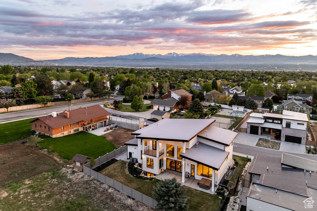 Aerial perspective of suburban area with a mountain backdrop