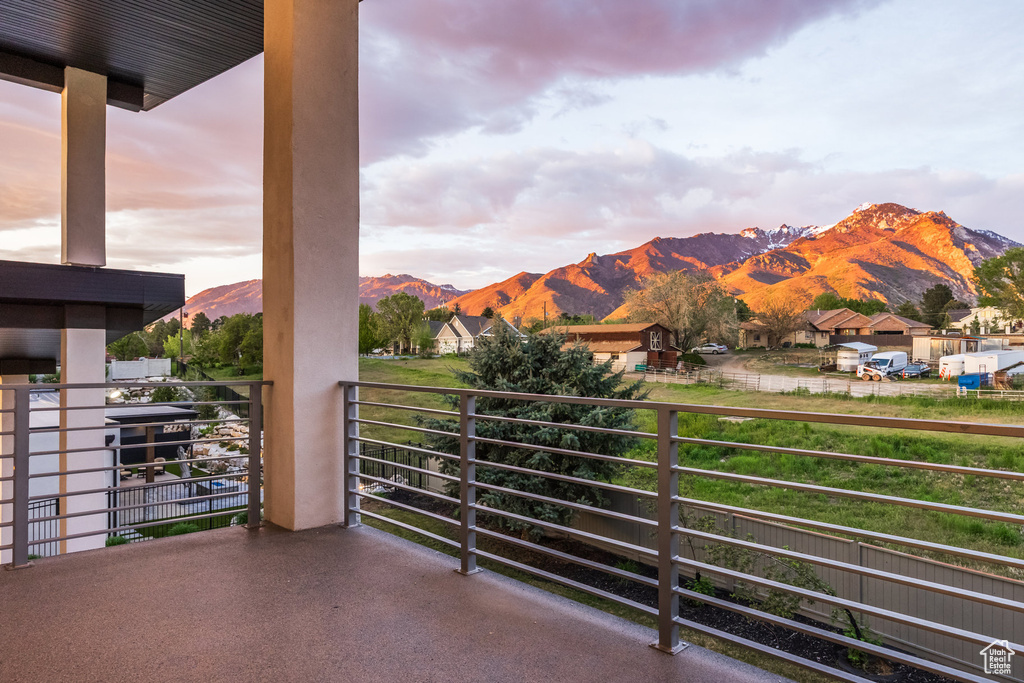 Balcony featuring a mountain view and a residential view