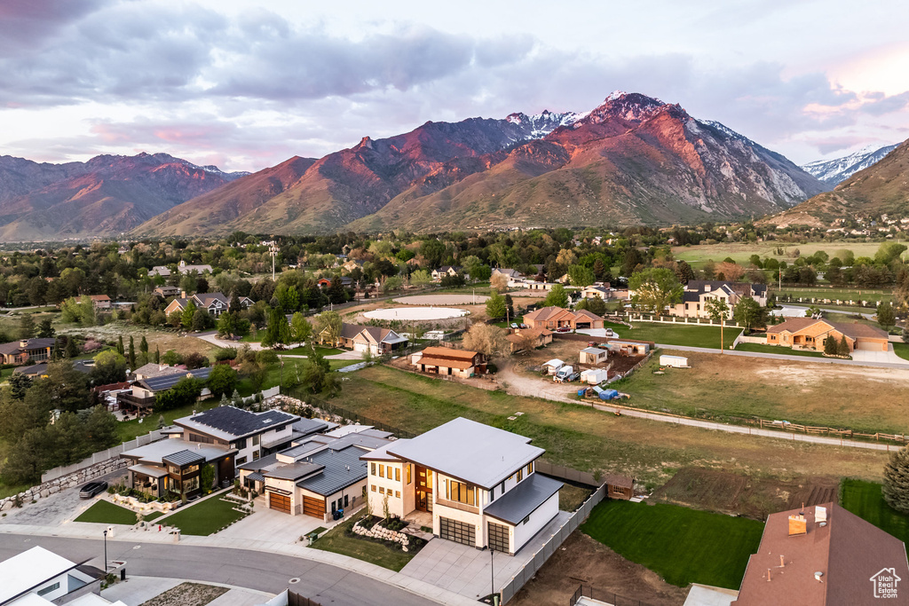Aerial perspective of suburban area featuring a mountainous background