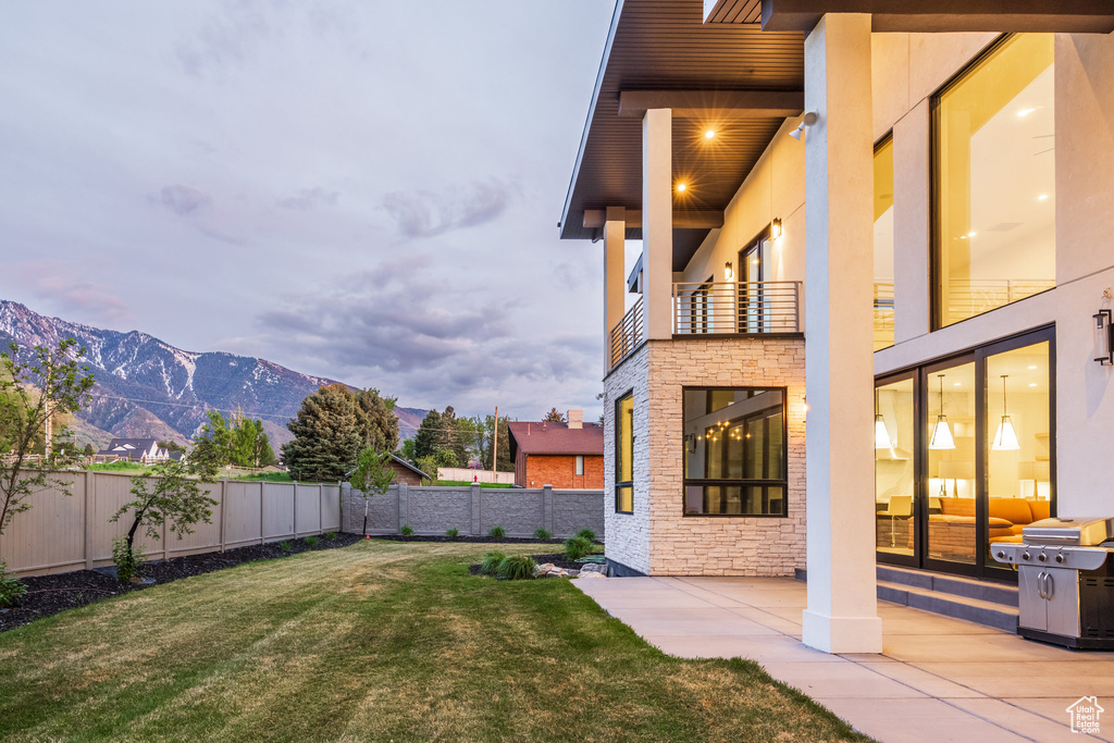 View of yard featuring a mountain view and a patio