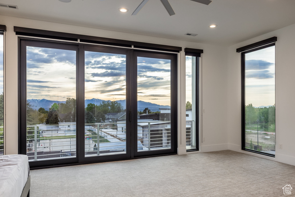 Doorway to outside featuring a ceiling fan, a mountain view, carpet flooring, recessed lighting, and baseboards