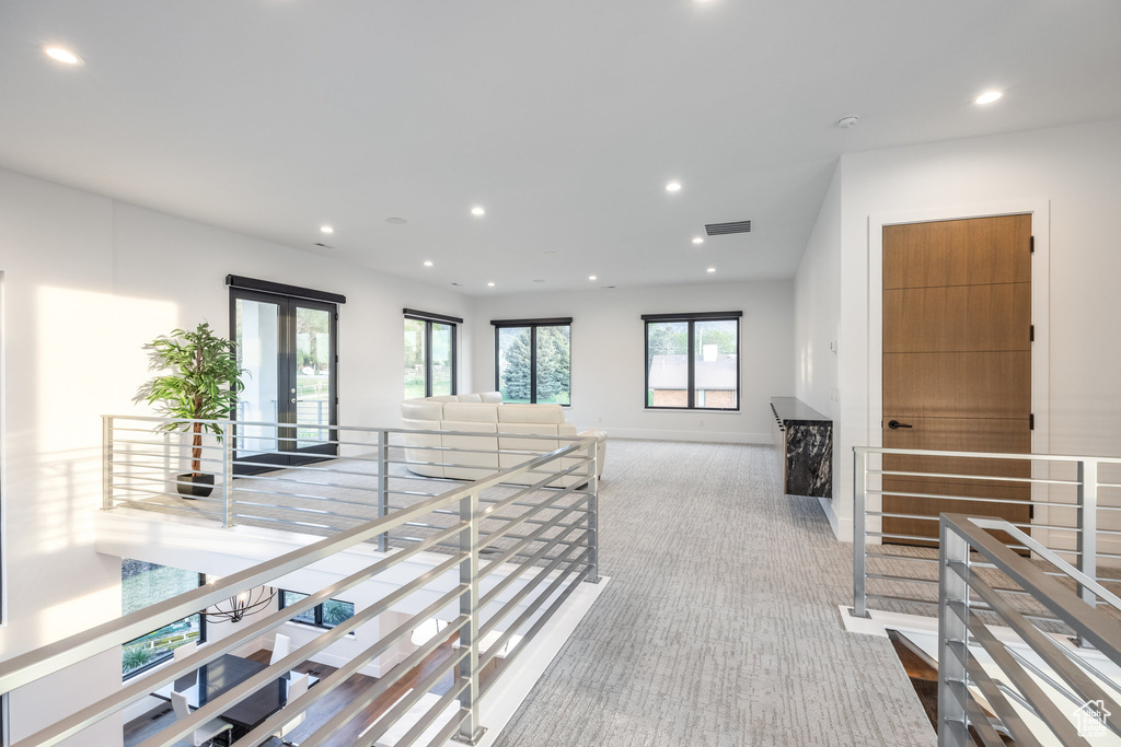 Corridor featuring carpet flooring, an upstairs landing, recessed lighting, and baseboards