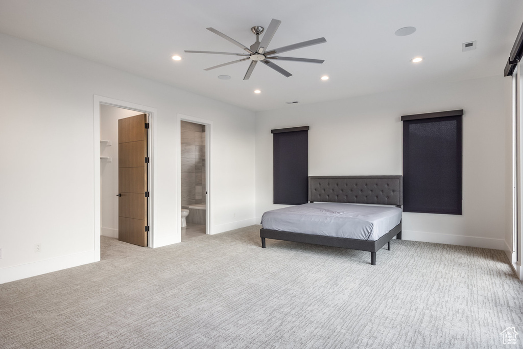 Carpeted bedroom with recessed lighting, baseboards, a ceiling fan, a spacious closet, and connected bathroom