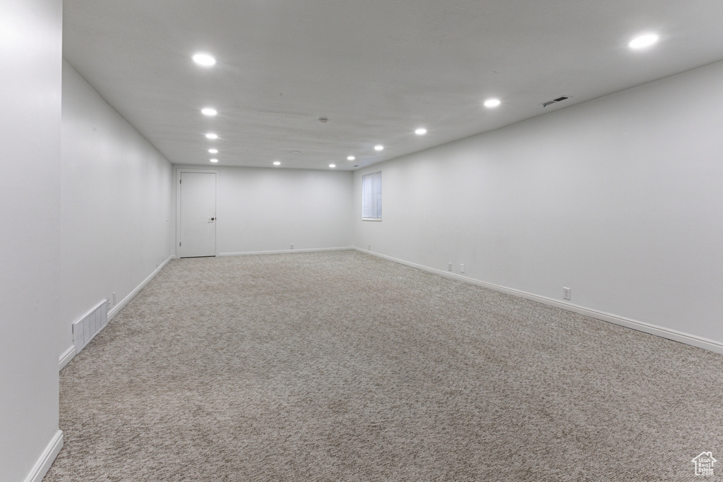 Unfurnished room with recessed lighting, carpet flooring, and baseboards