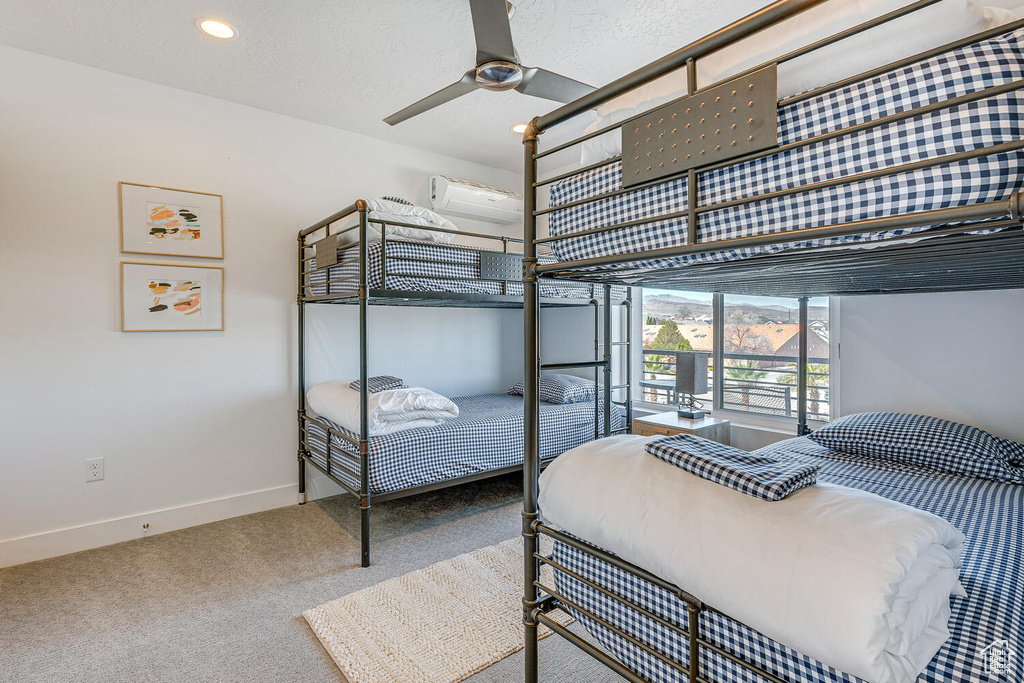 Bedroom featuring carpet, baseboards, recessed lighting, and a textured ceiling