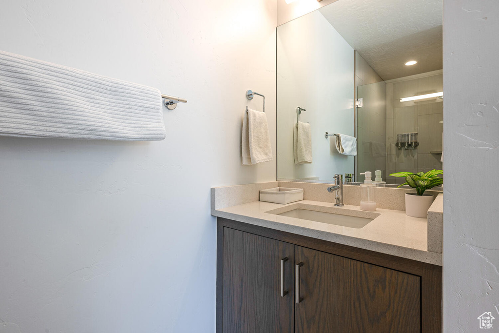 Bathroom with vanity and an enclosed shower