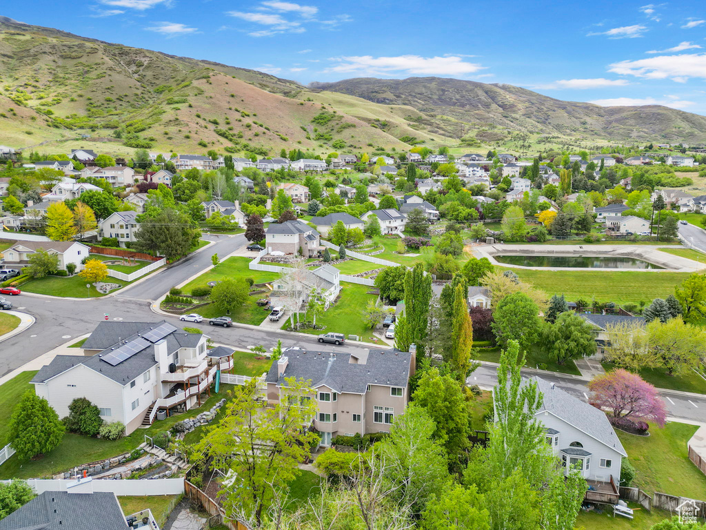 Aerial view of residential area featuring mountains