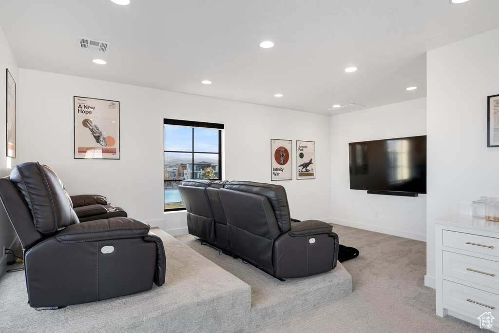 Home theater with light carpet, recessed lighting, and baseboards