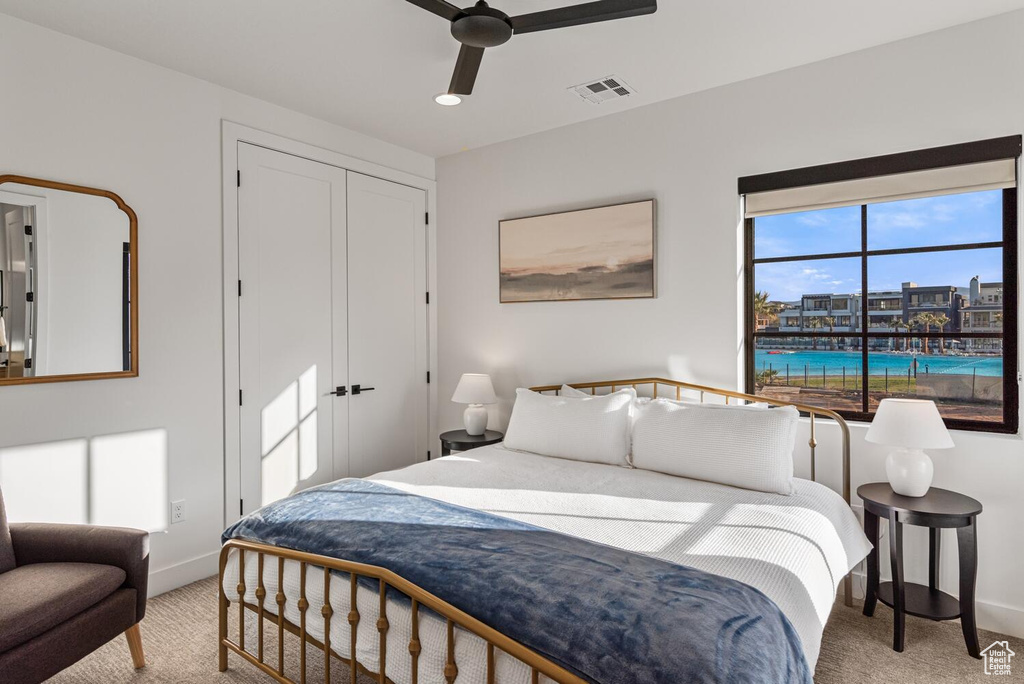 Bedroom featuring light colored carpet, baseboards, a closet, a ceiling fan, and recessed lighting