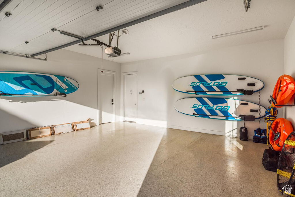 Garage featuring a garage door opener