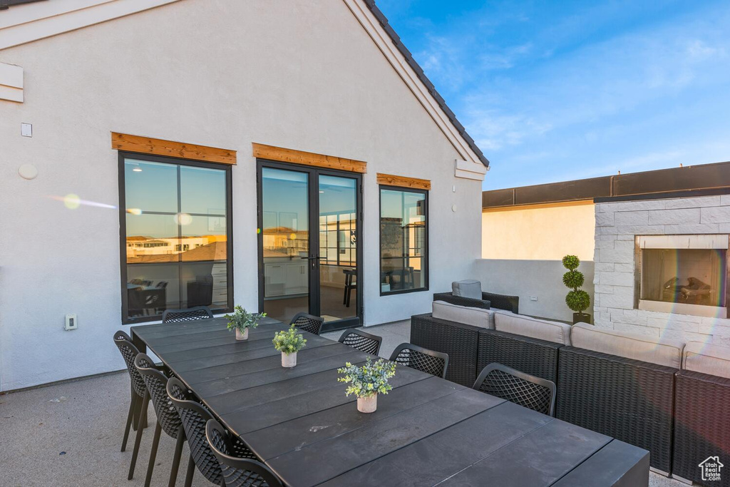 View of patio / terrace featuring outdoor dining area and an outdoor living space