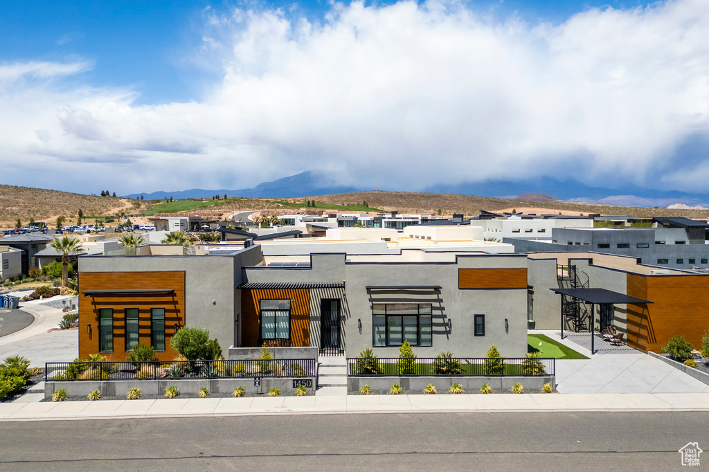 Contemporary home featuring stucco siding and a mountain view