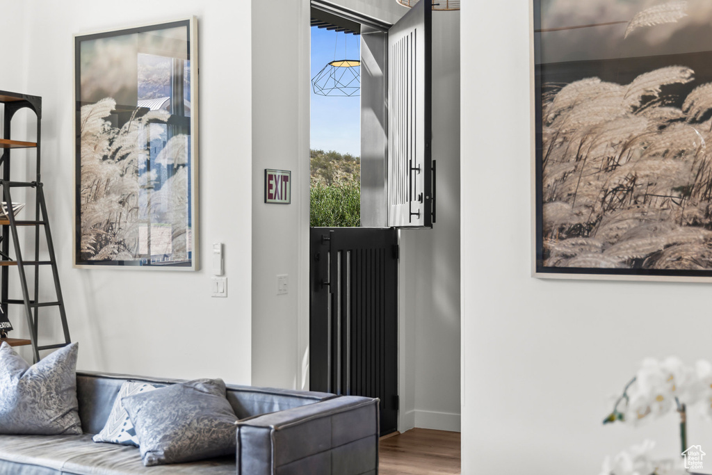 Doorway featuring wood finished floors and baseboards