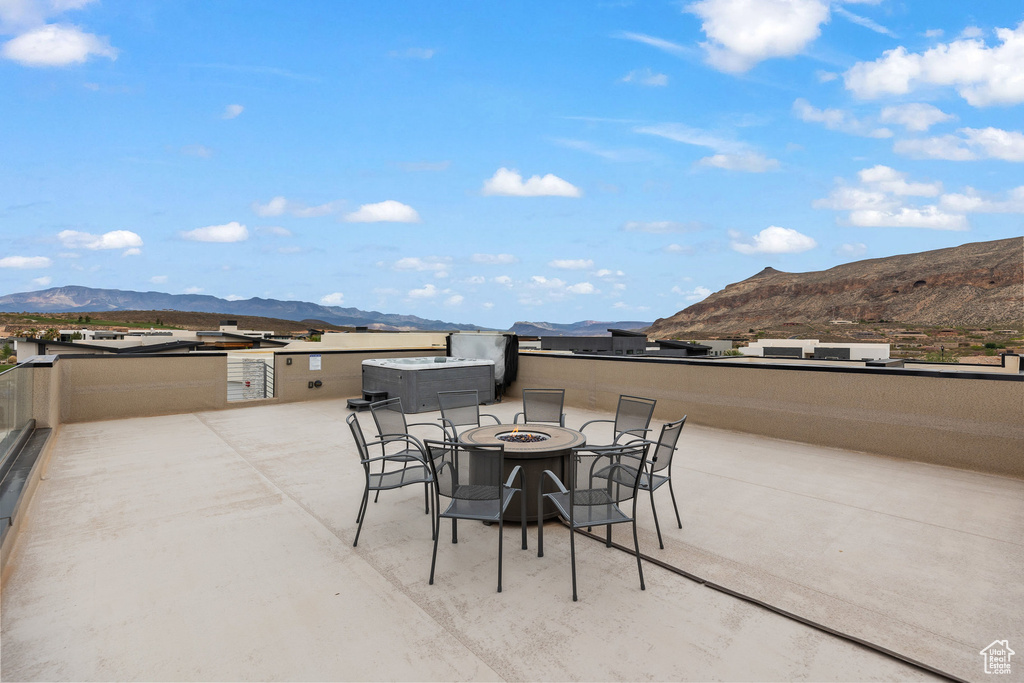 View of patio featuring a mountain view and a fire pit