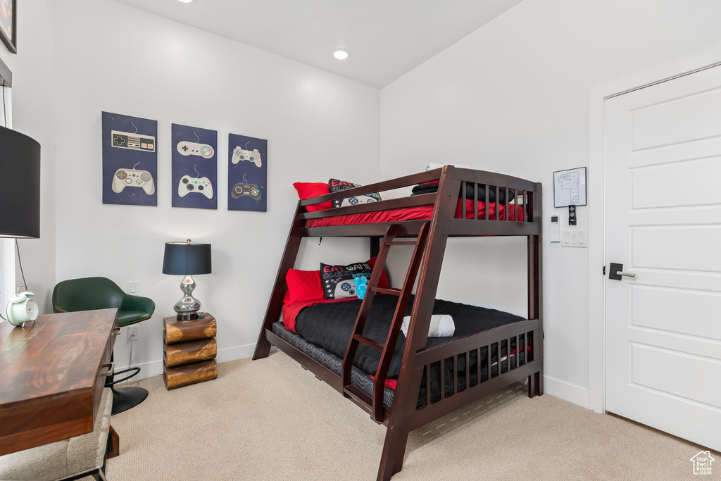 Carpeted bedroom with baseboards, a desk, and recessed lighting