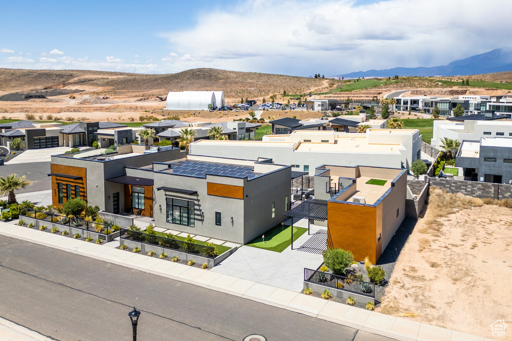 Aerial view of residential area with a mountain backdrop