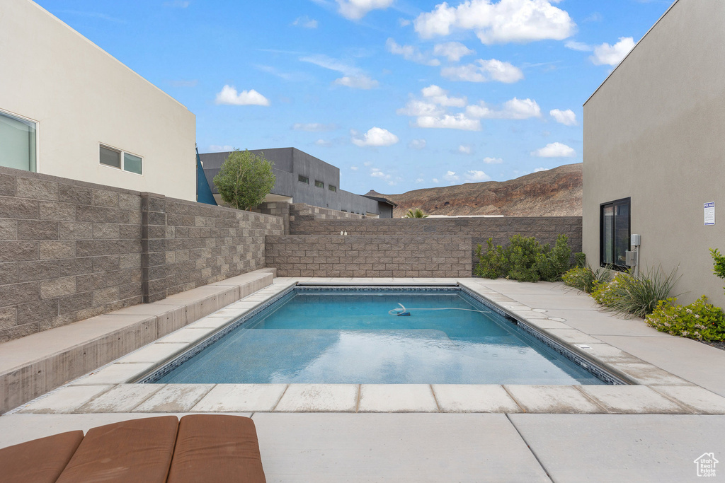 View of swimming pool featuring a fenced backyard