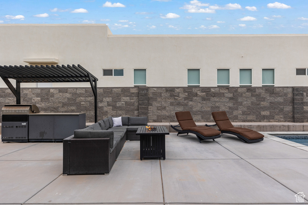 View of patio / terrace with an outdoor living space with a fire pit, a pergola, and area for grilling