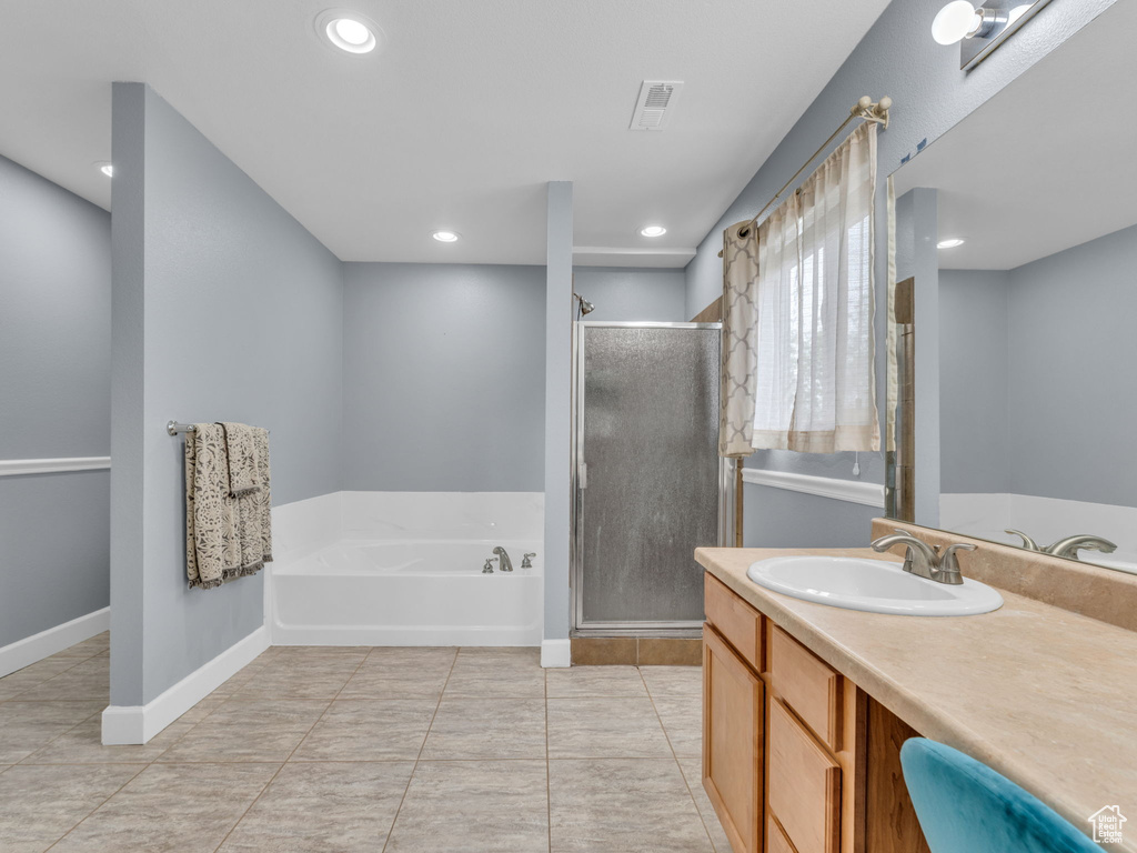 Full bathroom with vanity, visible vents, recessed lighting, a shower stall, and a garden tub