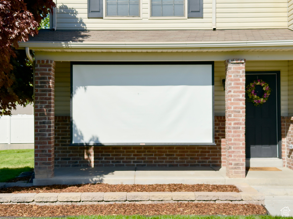 Exterior view of brick siding, a downspout, and gutters