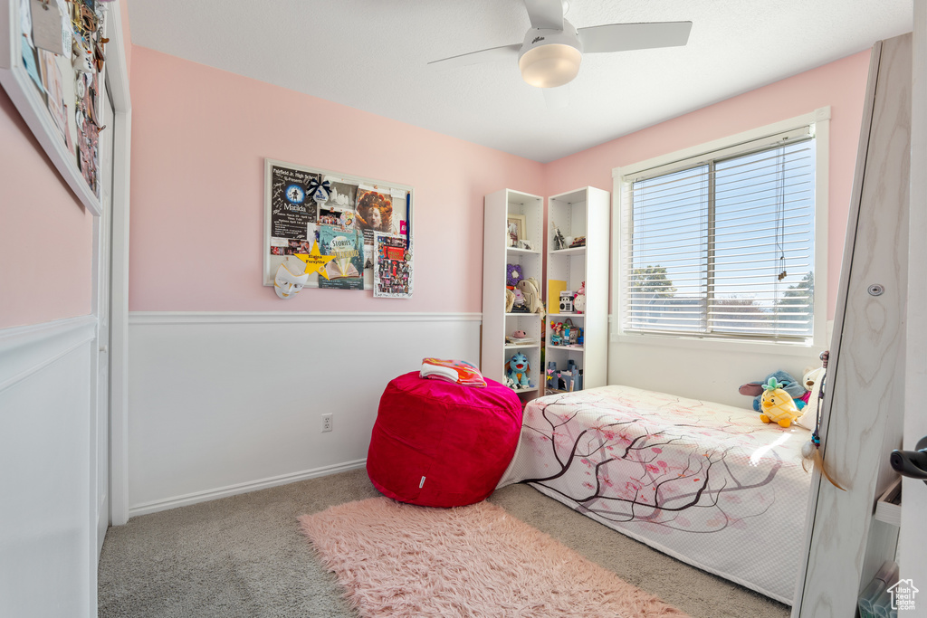 Bedroom with carpet floors and a ceiling fan