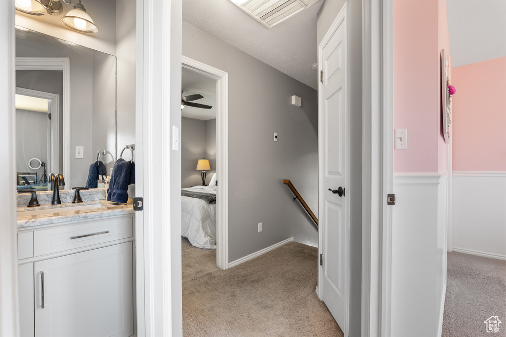 Bathroom featuring vanity and baseboards