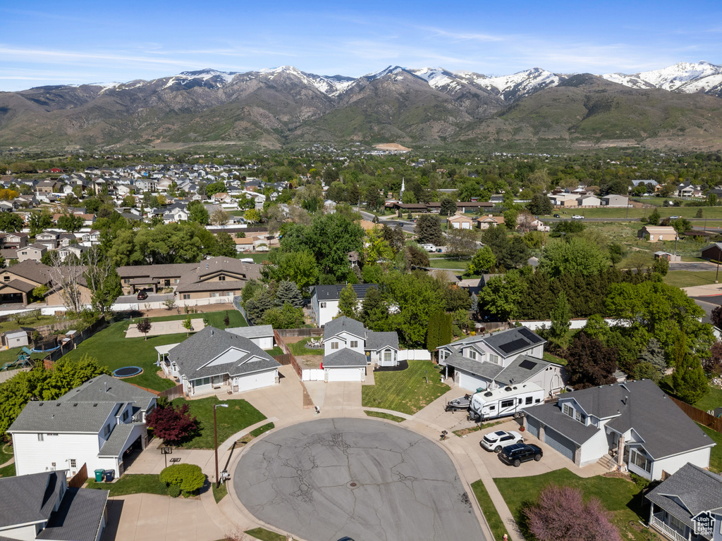 Aerial perspective of suburban area featuring a mountain backdrop