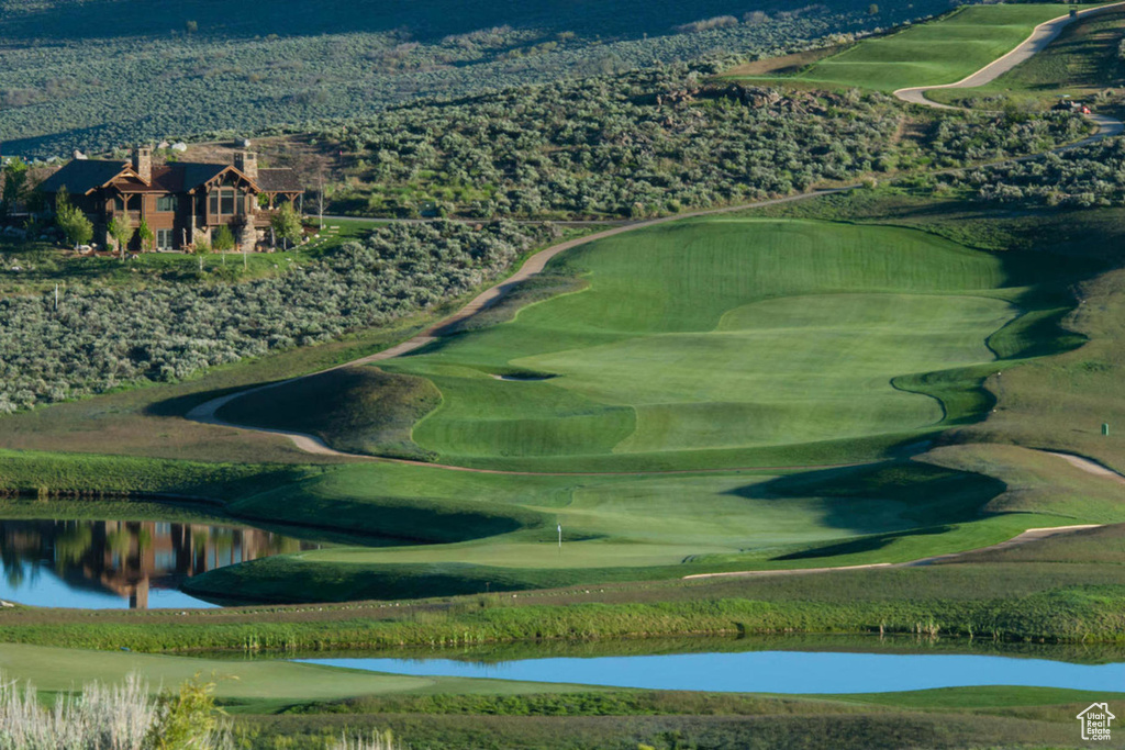 Surrounding community featuring a water view and view of golf course