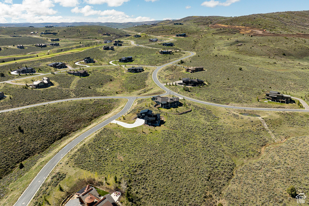 Aerial view of property and surrounding area with mountains and rural landscape