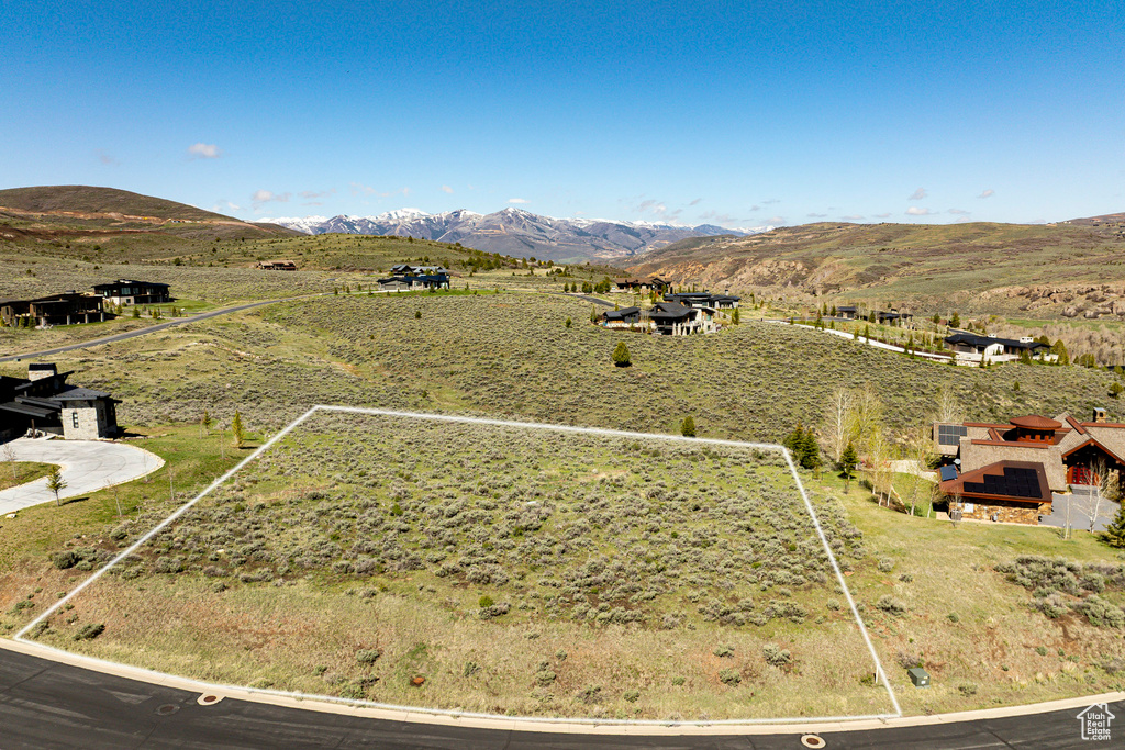 Overview of rural landscape with property boundaries highlighted and mountains