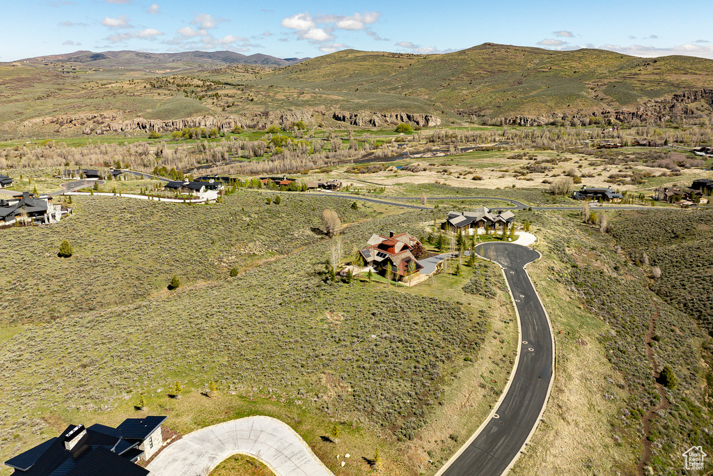Aerial overview of property's location with mountains and rural landscape