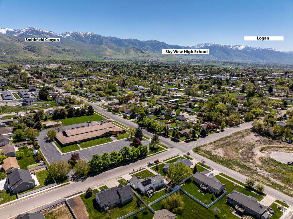 Aerial view of residential area featuring a mountainous background