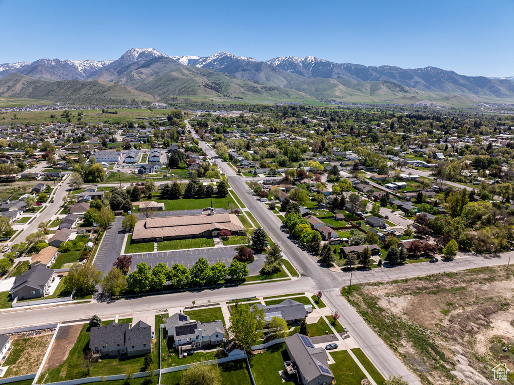 Aerial perspective of suburban area with a mountainous background