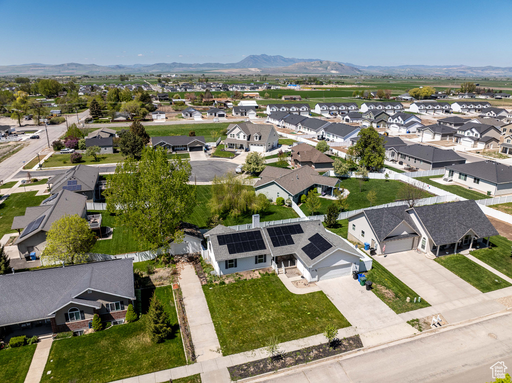 Aerial view of residential area with a mountain backdrop