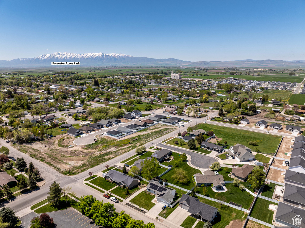 Aerial view of residential area featuring mountains